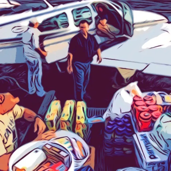 Volunteers loading supplies into a Cessna